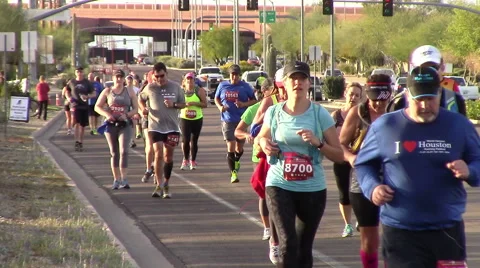 Front view of runners participating in a marathon Stock Footage 60856201