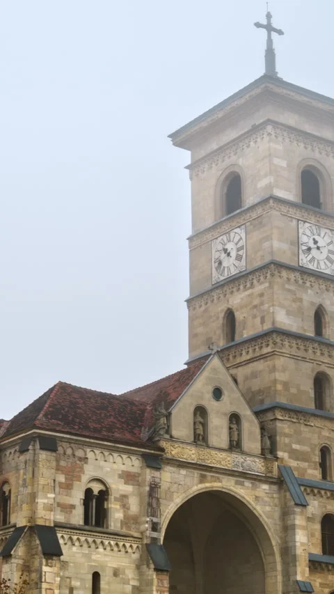 Front view of the Saint Michael Cathedral in Alba Iulia, Romania on a foggy Stock Footage 297227375
