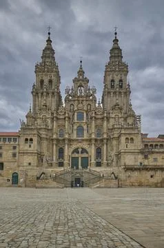Front view of Santiago de Compostela Cathedral under cloudy sky Stock Photos