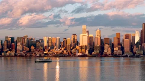 Front view of Seattle downtown during twilight illuminated with golden ligh.. Stock Footage 321792081