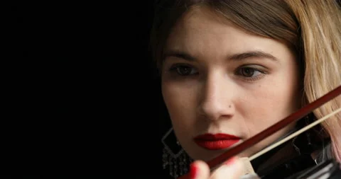 Front view, selective focus, young violinist, pink hair Stock Footage 239976994