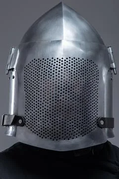 Front View of a Shiny Perforated Medieval Helmet. This image presents a fro.. Stock Photos