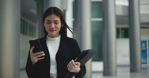 Front view shot, Footage of Young smiling elegant Asian busy business woman Stockbeeldmateriaal 241985668
