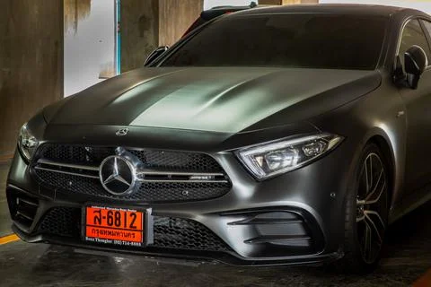 Front view shot of Matte black mercedes sports car parked in the parking lot. Stock Photos