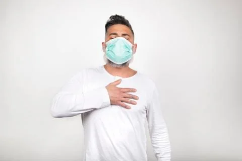 Front view of sick man presenting symptoms of coronavirus on white background Stock Photos