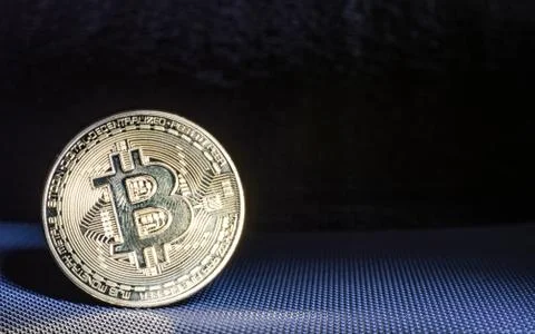 Front view of single golden bit coin Foto stock