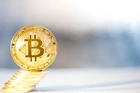 Front view of single golden bit coin Stock Photos