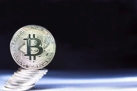 Front view of single golden bit coin Stock Photos