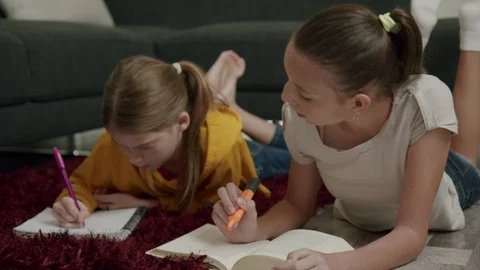 Front View sisters Studying together doing homework at home Stock Footage 126048295