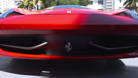 Front view of a sleek red Ferrari luxury sports car Stock Footage 342563146