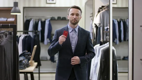 A front view slow motion general video of a business man standing in a clothing Stock Footage 137604786
