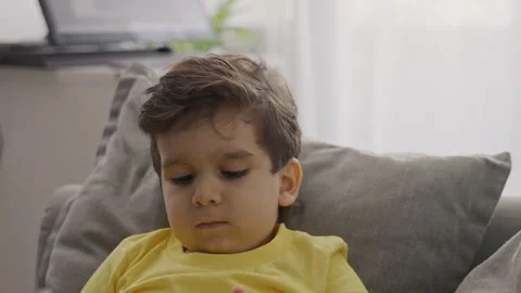 Front view small kid having fun using cellphone Stock Footage 246125597