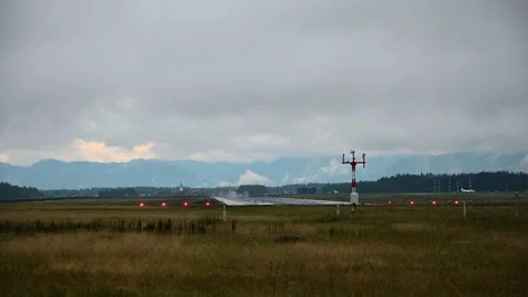 Front view of small passenger airplane taking off on a wet runway Stock Footage 211877393