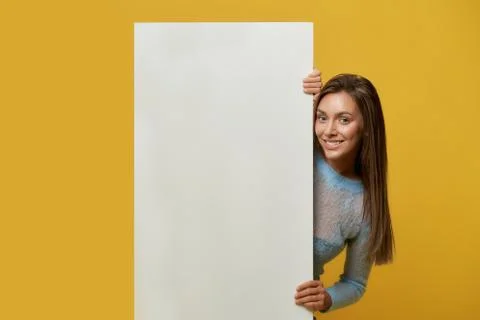 Front view of smiling girl holding banner. Stock Photos