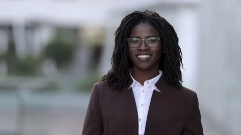 Front view of smiling woman with dreadlocks looking at camera Video stock 114963434