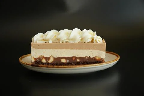 Front View of Snickers Inspired Layered Dessert Cake with Caramel and Nuts Stock Photos