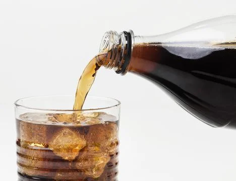 Front view soft drink being poured glass Stock Photos