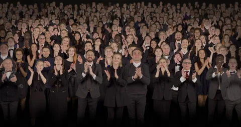 Front view of spectators in formal attire applaud during performance Video stock 170944899
