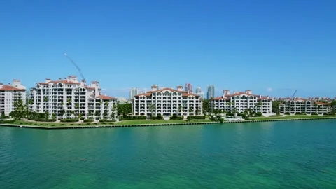 Front view on splendid high-rise dwellings along shoreline with turquoise waters Stock Footage 247764310
