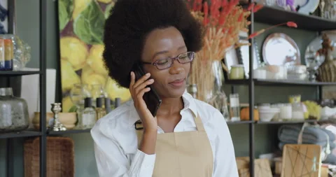 Front view of splendid joyful carefree young black-skinned woman with african Stock Footage 143931337