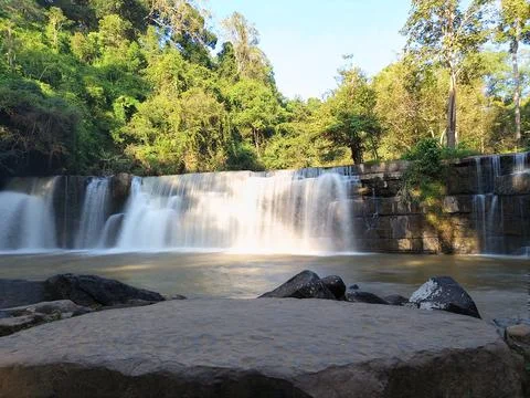 Front view, Sri Dit Waterfall is a small and forested one-level waterfall Stock Photos