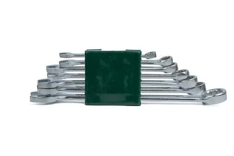 Front view of stacked combination wrenches secured in plastic holder. Stock Photos