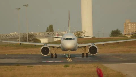 Front view of a standing passenger plane with turbines running on the runwa.. Stock Footage 249273906