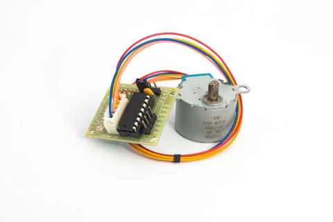Front view of a step motor module and its driver module connected by cables.  Stock Photos