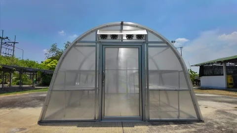 Front view of sun dryer glass house for dried fruit preservation Stock Footage 276339232