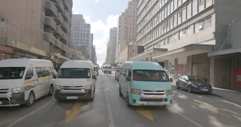 Front View of Taxis Driving Down the Road Johannesburg CBD Day Stock Footage 196403263