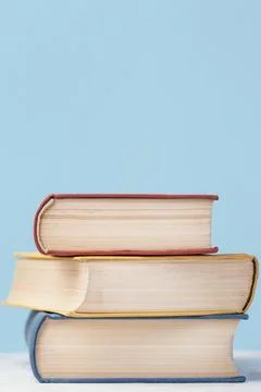 Front view three colored stacked books with copy space Stock Photos