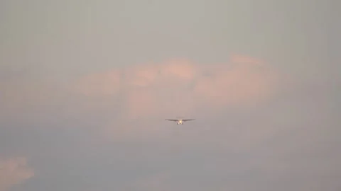 Front view of a turbo-prop passenger airplane approaching the airport Stock Footage 245449233