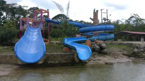 Front view of two waterslides with a blue coloration Stock Footage 154694366