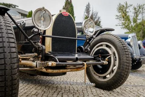 Front view of unique Bugatti Type 35 race car from 1920s on cobblestone road Stock Photos