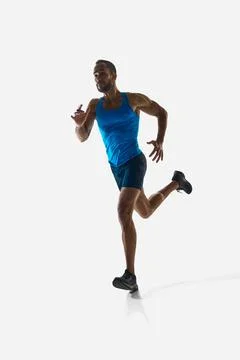Front view vertical image of concentrated man, runner with muscular strong body Stock Photos