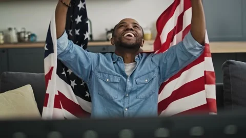 Front view video of extremely happy man with USA flag. Video stock 141919672