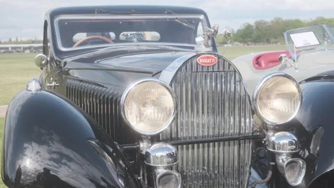 Front view of a vintage Bugatti displayed during a classic car rally d'Aumale Stock Footage 333914677