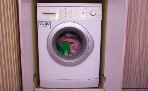 Front view of a washing machine drum during cleaning clothes Stock Photos