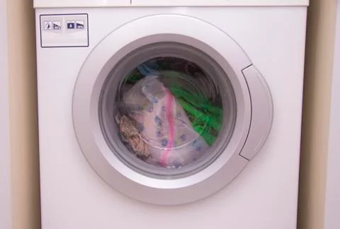 Front view of a washing machine drum during cleaning clothes Stock Photos