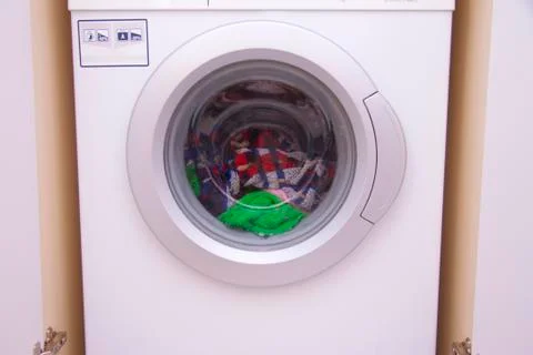 Front view of a washing machine drum during cleaning clothes Stock Photos