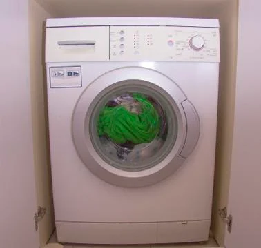 Front view of a washing machine drum during cleaning clothes Stock Photos