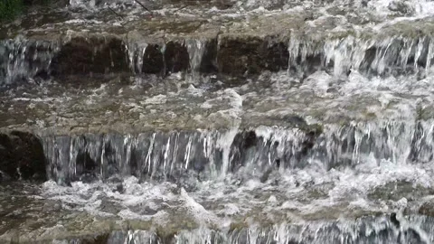Front View Of Water Cascading Down Stones On A Lake In The Woods Stock Footage 150928587