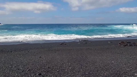 Front view of  waves on a black sand beach in Lanzarote, Canary islands, Spain Stock Footage 74662293
