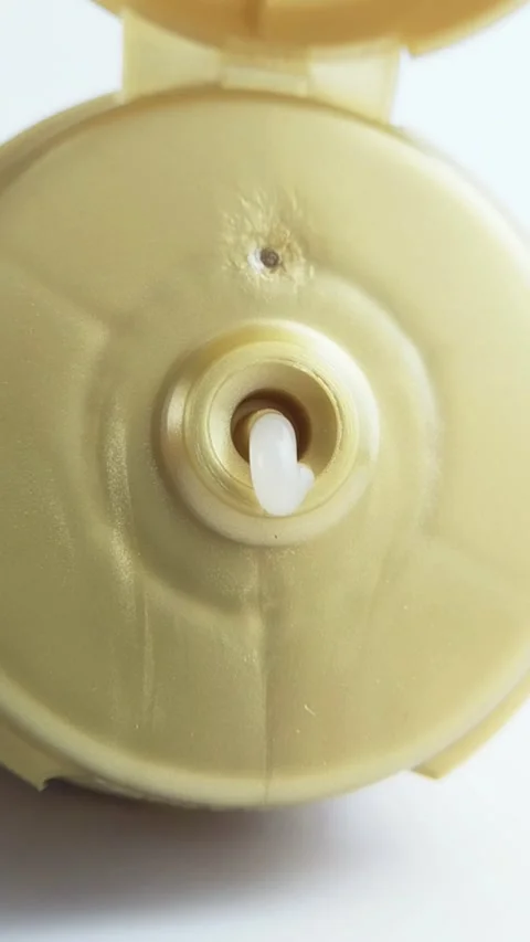 Front view of white beauty cream coming out from product packaging. Stock Footage 335296958