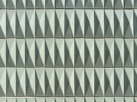 Front view of white ceramic tiles with a raised diamond relief pattern crea.. Stock Photos