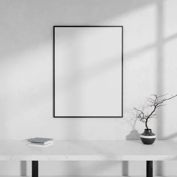 A front view of a white console table and an empty picture frame against a .. Stock Photos