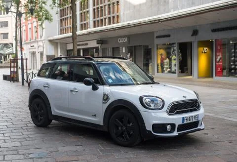 Front view of white mini cooper S countryman electric parked in the street Stock Photos