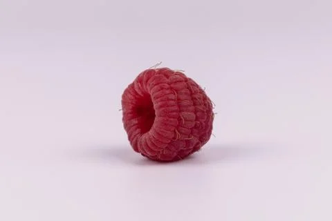 Front view of whole red raspberry without leaf with hole on white background Stock Photos
