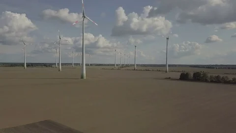 Front view on the Windmill field Energy Production - Aerial Stock Footage 83800704