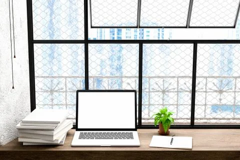 Front view of workpark with blank laptop screen, blank frame, and notebook in Stock Photos